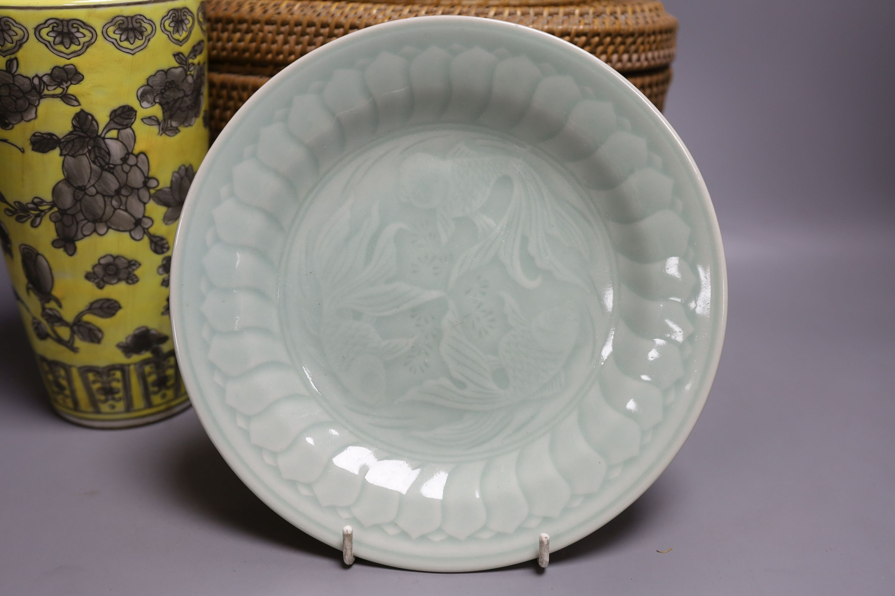 Two wicker-cased Chinese porcelain teapots together with a Chinese celadon dish and yellow vase, 28cm tall, (4)
